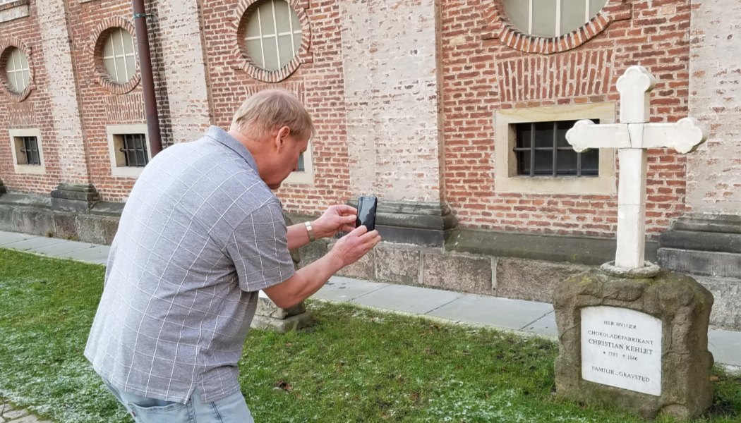 man, photography, GPS, BillionGraves, gravestone, grave, damaged gravestones, cemetery, family history, ancestors, community service project, JustServe, BillionGraves app, ivy, plant growth, JustServe,