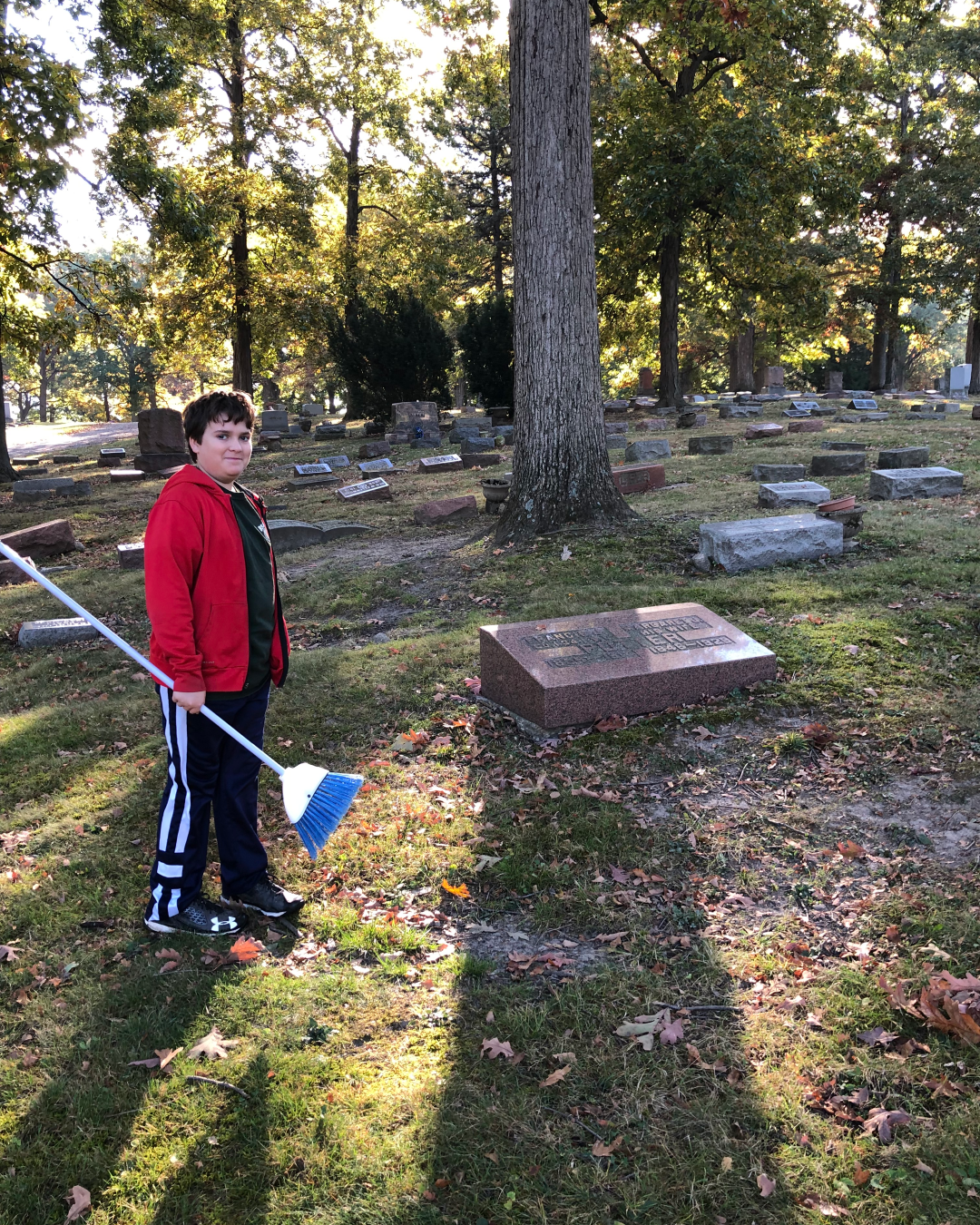 BillionGraves, gravestone, grave, damaged gravestones, cemetery, family history, ancestors, community service project, JustServe, BillionGraves app, ivy, plant growth, JustServe, broom, cemetery preservation