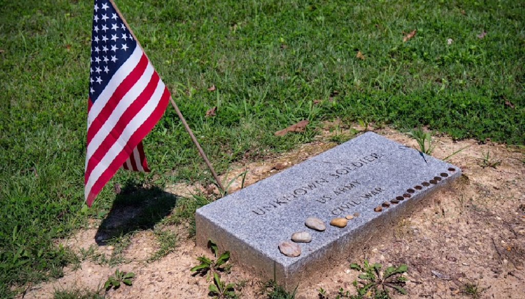 coins on gravestone, rocks on grave, flag, BillionGraves, Eagle Scout, BSA, Boy Scouts, boy Scouts of America, outstanding Eagle Scouts, Eagle Scout project, Eagle Scout project ideas, BillionGraves, cemetery, genealogy, ancestors, family history, GPS, GPS-linked photos, gravestones, gravestone photos, cemetery documentation, unknown soldier