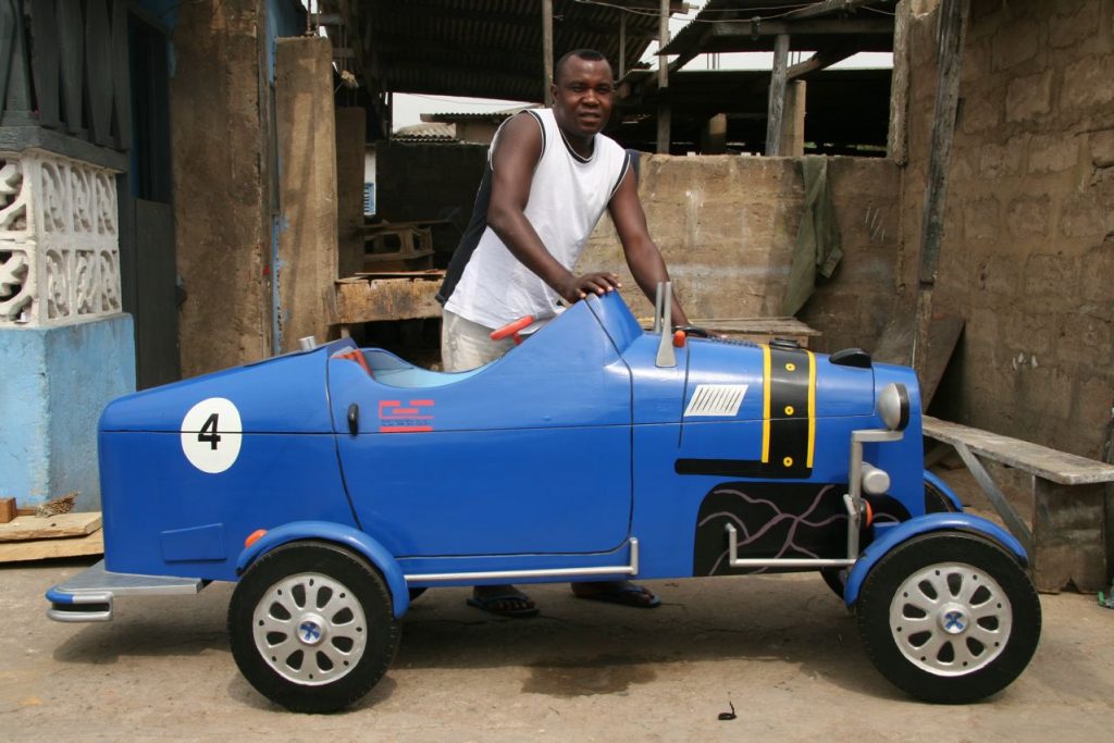 coffin, fantasy coffin, Ghana, car, BillionGraves, family, family history, burial customs from around the world, burial customs, burial practices, funeral, cemetery, gravestone, grave, GPS, ancestors, ancestry, genealogy, family history, BillionGraves app,