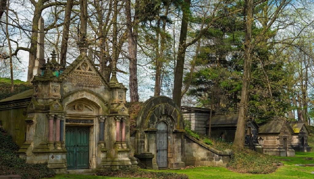 A row of old weather-beaten mausoleums in a Cleveland cemetery; family history, genealogy, BillionGraves, ancestors, cemetery, gravestones, BG, family vacation, genealogy trip