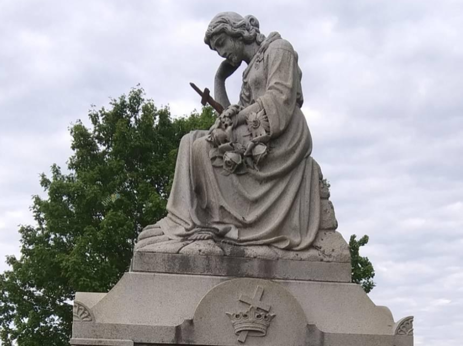 grieving mother, BillionGraves, baby, infant, gravestone, lamb, grave, cemetery, GPS, mobile app, mobile phone, GPS cemetery data, grave, gravestone, ancestors, genealogy, family history, crown, cross