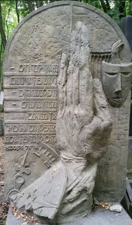 BillionGraves, hand, finger, pointing, gravestone symbols, gravestone symbolism, GPS, app, mobile app, community service, genealogy, ancestory, ancestry, heritage, cemetery, gravestones, gravestone, grave, genealogy, family history, historic preservation, poland, time, clock, gravestone symbols, mask